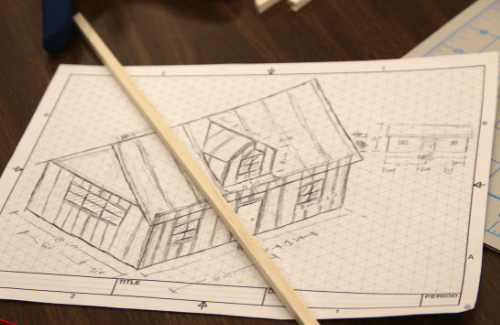 Pencil drawing on graph paper of a building structure