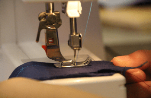 Close up of a sewing machine making a stitch